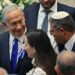 Israeli right wing Knesset member Itamar ben Gvir (R) chats with incoming Prime Minister Benjamin Netanyahu (L) during the swearing in ceremony of the new Israeli government at the Knesset (Israeli parliament) in Jerusalem, on November 15, 2022. - Israel swore in a new parliament today hours after a deadly attack, as veteran hawk Benjamin Netanyahu advances talks on forming what could be the country's most right-wing government ever. (Photo by ABIR SULTAN / POOL / AFP) (Photo by ABIR SULTAN/POOL/AFP via Getty Images)