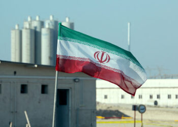 A picture taken on November 10, 2019, shows an Iranian flag in Iran's Bushehr nuclear power plant, during an official ceremony to kick-start works on a second reactor at the facility. - Bushehr is Iran's only nuclear power station and is currently running on imported fuel from Russia that is closely monitored by the UN's International Atomic Energy Agency. (Photo by ATTA KENARE / AFP)