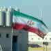 A picture taken on November 10, 2019, shows an Iranian flag in Iran's Bushehr nuclear power plant, during an official ceremony to kick-start works on a second reactor at the facility. - Bushehr is Iran's only nuclear power station and is currently running on imported fuel from Russia that is closely monitored by the UN's International Atomic Energy Agency. (Photo by ATTA KENARE / AFP)