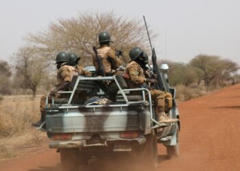 FILE PHOTO: Soldiers from Burkina Faso patrol on the road of Gorgadji in the Sahel area, Burkina Faso March 3, 2019. Picture taken March 3, 2019. REUTERS/Luc Gnago/File Photo/File Photo