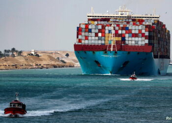 A shipping container passes through the Suez Canal in Suez, Egypt February 15, 2022. Picture taken February 15, 2022. REUTERS/Mohamed Abd El Ghany