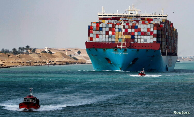 A shipping container passes through the Suez Canal in Suez, Egypt February 15, 2022. Picture taken February 15, 2022. REUTERS/Mohamed Abd El Ghany