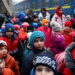 A group of children evacuated from an orphanage in Zaporizhzhia wait to board a bus for their transfer to Poland after fleeing the ongoing Russian invasion at the main train station in Lviv, Ukraine, March 5, 2022.   REUTERS/Kai Pfaffenbach REFILE - CORRECTING INFORMATION