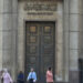 FILE PHOTO: People walk in front of the Central Bank of Egypt's headquarters at downtown Cairo, Egypt, November 3, 2016. REUTERS/Mohamed Abd El Ghany/File Photo