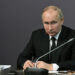 Russian President Vladimir Putin attends a meeting with local residents, veterans and representatives of civil society organizations to mark the 80th anniversary of a breakthrough in the siege of Leningrad during World War Two at the State Memorial Museum of the Defence and Siege of Leningrad in Saint Petersburg, Russia, January 18, 2023. Sputnik/Ilya Pitalyov/Pool via REUTERS ATTENTION EDITORS - THIS IMAGE WAS PROVIDED BY A THIRD PARTY.