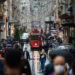 People wearing face masks walk on Istiklal Street, in Istanbul, on October 9, 2020. (Photo by Yasin AKGUL / AFP)