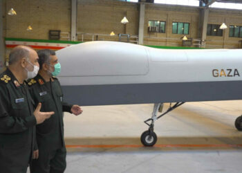 In this photo released on Saturday, May 22, 2021, by Sepahnews of the Iranian Revolutionary Guard, the Guard's Commander Gen. Hossein Salami, left, and the Guard's aerospace division commander Gen. Amir Ali Hajizadeh talk while unveiling a new drone called "Gaza" in an undisclosed location in Iran. (Sepahnews via AP)