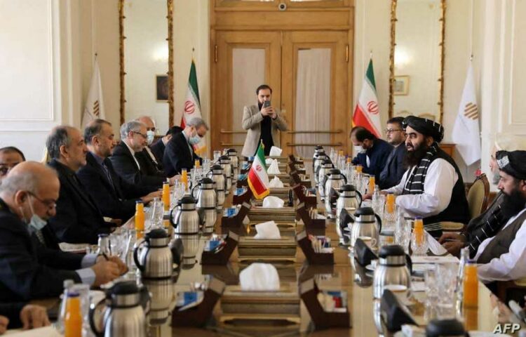 This handout picture provided by the Iranian foreign ministry shows Iranian Foreign Minister Hossein Amir-Abdollahian (2nd-L) meeting with his Afghan counterpart Amir Khan Muttaqi (R) in Tehran on January 9, 2022. (Photo by Iranian Foreign Ministry / AFP) / === RESTRICTED TO EDITORIAL USE - MANDATORY CREDIT "AFP PHOTO / HO / IRANIAN FOREIGN MINISTRY" - NO MARKETING NO ADVERTISING CAMPAIGNS - DISTRIBUTED AS A SERVICE TO CLIENTS ===