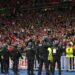 Riot police watch Liverpool fans during the Champions League final soccer match between Liverpool and Real Madrid at the Stade de France in Saint Denis near Paris, Saturday, May 28, 2022. (AP Photo/Manu Fernandez)