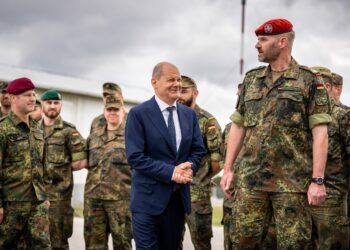 10 June 2022, Kosovo, Pristina: German Chancellor Olaf Scholz (SPD), talks to KFOR contingent commander Stefan Bründermann during a visit to the Bundeswehr. On the first day of his trip to the Balkans, Scholz will visit Serbia, Kosovo and Greece. He will then continue to northern Macedonia and Bulgaria. The trip will focus on the EU accession prospects for six countries in the Western Balkans. Photo: Michael Kappeler/dpa (Photo by Michael Kappeler/picture alliance via Getty Images)