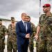 10 June 2022, Kosovo, Pristina: German Chancellor Olaf Scholz (SPD), talks to KFOR contingent commander Stefan Bründermann during a visit to the Bundeswehr. On the first day of his trip to the Balkans, Scholz will visit Serbia, Kosovo and Greece. He will then continue to northern Macedonia and Bulgaria. The trip will focus on the EU accession prospects for six countries in the Western Balkans. Photo: Michael Kappeler/dpa (Photo by Michael Kappeler/picture alliance via Getty Images)