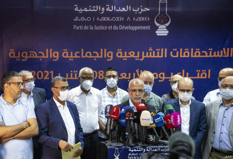 Members of Morocco's Islamist Justice and Development Party (PJD) hold a press conference in the capital Rabat to announce the resignation of its president Saad-Eddine el-Othmani and all members of its general secretariat, after it came in 8th in parliamentary and local elections, on September 9, 2021. - Morocco's long-ruling Islamists have suffered a crushing defeat in parliamentary elections, coming far behind their main liberal rivals, the National Rally of Independents (RNI) and the Authenticity and Modernity Party (PAM) seen as close to the palace, according to provisional results. (Photo by FADEL SENNA / AFP)