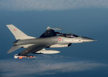 FILE PHOTO: A Danish F16 fighter jet demonstrates the interception of a Belgian air force transport plane as they fly over Denmark, January 14, 2020 as part of NATO drills to deter Russian planes from entering allied airspace. Picture taken January 14, 2020. REUTERS/Johanna Geron/File Photo