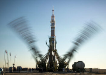 This NASA  handout photo shows the Soyuz TMA-11M rocket, adorned with the logo of the Sochi Olympic Organizing Committee and other related artwork, seen in this long exposure photograph, as the service structure arms are raised into position at the launch pad on November 5, 2013, Baikonur Cosmodrome in Kazakhstan. Launch of the Soyuz rocket is scheduled for November 7 and will send Expedition 38 Soyuz Commander Mikhail Tyurin of Roscosmos, Flight Engineer Rick Mastracchio of NASA and Flight Engineer Koichi Wakata of the Japan Aerospace Exploration Agency on a six-month mission aboard the International Space Station. AFP PHOTO/NASA/BILL INGALLS = RESTRICTED TO EDITORIAL USE - MANDATORY CREDIT "AFP PHOTO / NASA / BILL INGALLS" - NO MARKETING NO ADVERTISING CAMPAIGNS - DISTRIBUTED AS A SERVICE TO CLIENTS= (Photo by BILL INGALLS / NASA / AFP)