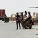 Jordanian soldiers stand guard near their military vehicles at the Al-Karameh border point with Iraq on June 25, 2014 as Jordan reinforced its border with Iraq after Sunni Arab militants overran a crossing with Syria. Sunni insurgents led by the jihadist Islamic State of Iraq and the Levant (ISIL) overran swathes of land north and west of Baghdad this month sparking fears in Amman that they will take the fight to Jordan, which is already struggling with its own home-grown Islamists.    AFP PHOTO/STR