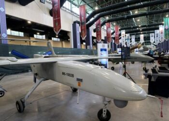 The "Mohajer 6" drone is displayed during Iran's defence industry achievements exhibition, on August 23, 2023 in Tehran. Iran unveiled on August 22 its latest domestically built drone that can fly at a higher altitude and for a longer duration with enhanced weapons capabilities, state media reported. (Photo by ATTA KENARE / AFP)