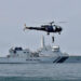 An Indian Navy "Chetak" helicopter demonstrates a rescue operation past the Coast Guard's Offshore Patrol Vessel (OPV) "Sarathi" during a media tour in the Arabian Sea near Kochi, India, November 6, 2019. REUTERS/Sivaram V