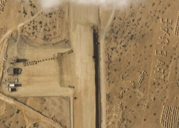 This satellite photo captured by Planet Labs PBC shows the construction of an airstrip on Abd al-Kuri Island, Yemen, Tuesday, March 26, 2024. As Yemen's Houthi rebels continue to target ships in a vital Mideast waterway, satellite pictures analyzed by The Associated Press show what appears to be a new airstrip being built at an entrance to that crucial maritime route. No country has claimed publicly the active construction taking place this month on Abd al-Kuri Island, a barren stretch of land rising out of the Indian Ocean near the mouth of the Gulf of Aden. However, satellite images shot for the AP appear to show workers have laid out "I LOVE UAE" next to the runway, an abbreviation for the United Arab Emirates. (Planet Labs PBC via AP)