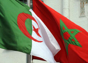 The flags of Algeria (L) and Morocco flutter as Algerian president greets Moroccan Foreign Minister on January 24, 2012 in Algiers. Moroccan Foreign Minister Saad Eddine Othmani yesterday began a fence-mending visit to Algeria to resolve disputes such as the neighbours' lingering row over Western Sahara. AFP PHOTO / FAROUK BATICHE (Photo by Farouk Batiche / AFP)