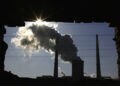 The window of a demolished house frames a chimney as it billows smoke from a nearby coal-burning power station in Beijing December 14, 2010. China will insist on keeping its greenhouse gas output free of any binding climate treaty fetters, a senior Chinese diplomat said, dismissing an earlier report that suggested a softening of Beijing's position as a "misunderstanding." The recent two-week climate change meeting in Cancun, Mexico showed an ever-broader belief that a legally binding deal is far off, partly because of opposition by China and the United States, the world's top emitters of greenhouse gases.   REUTERS/David Gray (CHINA - Tags: ENVIRONMENT SOCIETY BUSINESS POLITICS IMAGES OF THE DAY)