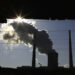 The window of a demolished house frames a chimney as it billows smoke from a nearby coal-burning power station in Beijing December 14, 2010. China will insist on keeping its greenhouse gas output free of any binding climate treaty fetters, a senior Chinese diplomat said, dismissing an earlier report that suggested a softening of Beijing's position as a "misunderstanding." The recent two-week climate change meeting in Cancun, Mexico showed an ever-broader belief that a legally binding deal is far off, partly because of opposition by China and the United States, the world's top emitters of greenhouse gases.   REUTERS/David Gray (CHINA - Tags: ENVIRONMENT SOCIETY BUSINESS POLITICS IMAGES OF THE DAY)