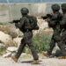 Members of the Israeli army inspect the scene of a shooting incident, near Jericho in the Israeli-occupied West Bank, March 28, 2024. REUTERS/Ammar Awad