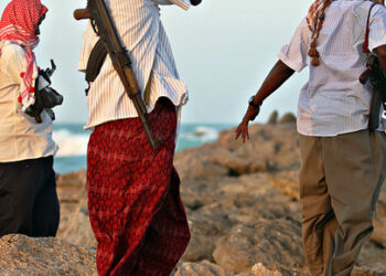 Photo made on January 4, 2010 shows armed Somali pirates keeping vigil on the coastline at Hobyo town in northeastern Somalia where Greek cargo ship, MV Filitsa, is anchored just off the shores of Hobyo where its being held by the pirates since it was captured November 10, 2009.  A six-nation east African regional bloc on February 1, 2010 urged Somalia's two breakaway regions of Puntland and Somaliland to jointly battle Islamist militia which it said had extended to the areas.
 . AFP PHOTO/ MOHAMED DAHIR / AFP PHOTO / MOHAMED DAHIR