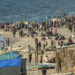 Palestinians gather on the beach in Deir el-Balah in the central Gaza Strip on April 17, 2024, amid the ongoing conflict between Israel and the militant group Hamas. (Photo by AFP)