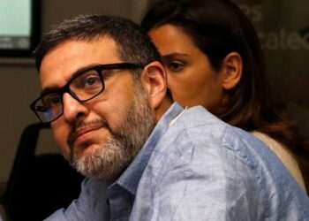 Beirut-based doctor Ghassan Abu Sitta sits inside a room at the American University of Beirut Medical Center in Lebanon while using Proximie technology to guide Hafez Abu Khousa, a surgeon in Gaza, in performing a medical operation, April 30, 2016. REUTERS/Mohamed Azakir