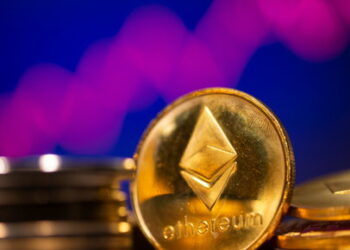 A representation of virtual currency Ethereum are seen in front of a stock graph in this illustration taken February 19, 2021. REUTERS/Dado Ruvic/Illustration