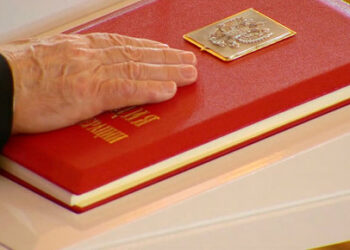 Russian President Vladimir Putin places his hand on the Constitution as he takes the oath during an inauguration ceremony at the Kremlin in Moscow, Russia May 7, 2024, in this still image taken from live broadcast video. Kremlin.ru/Handout via REUTERS ATTENTION EDITORS - THIS IMAGE WAS PROVIDED BY A THIRD PARTY. MANDATORY CREDIT.