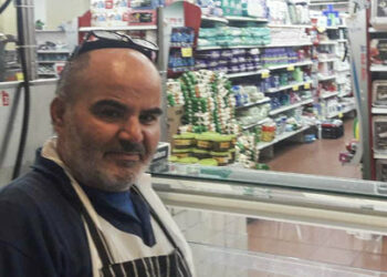 This 2021 photo provided by Haim Parag shows David Ben-Avraham at a supermarket in the Israeli town of Beit Shemesh, where he briefly worked. Ben-Avraham, a Palestinian who was born a Muslim but made the almost unheard-of decision to convert to Judaism years earlier, was fatally shot by an Israeli soldier. (Courtesy of Haim Parag via AP)