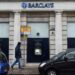 A man walks past a Barclays bank, in the Channel island's port capital Saint Helier, on December 11, 2022. (Photo by Sebastien SALOM-GOMIS / AFP)