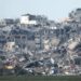 A picture taken from southern Israel near the border with the Gaza Strip on December 21, 2023, shows destruction in northern Gaza resulting from weeks of Israeli bombardment of the Palestinian territory amid ongoing battles with the Hamas militant group. (Photo by JACK GUEZ / AFP)