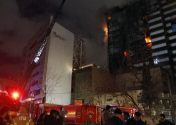 Iranian firefighters work to extinguish a fire which broke out at Gandhi Hospital in Iran's capital Tehran on January 25, 2024. The prompted an evacuation of the building, state media reported. It was not immediately clear what caused the fire and no casualties were reported. (Photo by AFP)