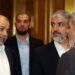 Exiled Chief of Hamas' Political Bureau Khaled Meshaal (2nd-R) speaks with Hamas deputy leader Musa Abu Marzuk (L) ahead of their conference in the Qatari capital, Doha on May 1, 2017. The Palestinian Islamist movement Hamas unveiled a new policy document easing its stance on Israel after having long called for its destruction, as it seeks to improve its international standing. (Photo by KARIM JAAFAR / AFP)