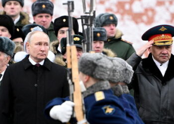 Russia's President Vladimir Putin and Defence Minister Sergei Shoigu watch honour guards passing by after a wreath laying ceremony marking Defender of the Fatherland Day at the Tomb of the Unknown Soldier by the Kremlin Wall in Moscow, Russia, February 23, 2024. Sputnik/Sergei Savostyanov/Pool via REUTERS ATTENTION EDITORS - THIS IMAGE WAS PROVIDED BY A THIRD PARTY.