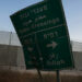 A damaged road sign stands at the Kerem Shalom border crossing, as military operations continue in the southern Gaza city of Rafah, at an area outside Kerem Shalom, Israel, May 17, 2024. REUTERS/Shannon Stapleton