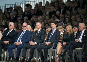 Queen Mathilde of Belgium, King Philippe of Belgium, Prince Albert II of Monaco, Poland's President Andrzej Duda, Canadian Prime Minister Justin Trudeau, U.S. First Lady Jill Biden, U.S. President Joe Biden and France's President Emmanuel Macron look on as they attend the International commemorative ceremony at Omaha Beach marking the 80th anniversary of the World War II "D-Day" Allied landings in Saint-Laurent-sur-Mer, Normandy, in northwestern France, June 6, 2024. LOU BENOIST/Pool via REUTERS