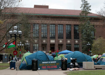 FILE PHOTO: A coalition of University of Michigan students camp in the Diag to pressure the university to divest its endowment from companies that support Israel or could profit from the ongoing conflict between Israel and the Palestinian Islamist group Hamas, on the University of Michigan college campus in Ann Arbor, Michigan, U.S., April 23, 2024. REUTERS/Rebecca Cook/File Photo