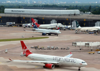 A picture taken from the new Air Traffic Control tower shows planes in Manchester airport, northwest England, on June 25, 2013, during a media preview of the 20 million British pound (31 million US dollars) facility which will be operational in the coming days. AFP PHOTO/Paul Ellis / AFP PHOTO / PAUL ELLIS