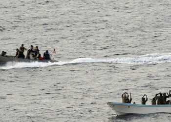 In this image relased by the US Navy, search and seizure team members (L) from the guided-missile cruiser USS Vella Gulf close in to apprehend suspected pirates (R) in the Gulf of Aden February 11, 2009. The Vella Gulf is the flagship for Combined Task Force 151, a multi-national task force conducting counterpiracy operations to detect and deter piracy in and around the Gulf of Aden, Arabian Gulf, Indian Ocean and Red Sea. It was established to create a maritime lawful order and develop security in the maritime environment.   AFP PHOTO/Navy Visual News Service/Jason R. Zalasky    = RESTRICTED TO EDITORIAL USE = GETTY OUT = (Photo by Jason R. Zalasky / Navy Visual News Service (NVNS) / AFP)