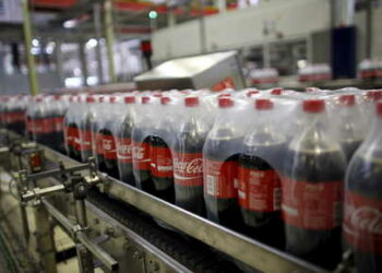 Bottles of Coca-Cola are pictured on a newly inaugurated production line at the Cikedokan Plant in Bekasi, West Java near Jakarta March 31, 2015. The Coca-Cola company inaugurated two new production lines as part of an investment package worth some $500 million to accelerate growth in the Indonesian market. REUTERS/Darren Whiteside