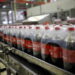 Bottles of Coca-Cola are pictured on a newly inaugurated production line at the Cikedokan Plant in Bekasi, West Java near Jakarta March 31, 2015. The Coca-Cola company inaugurated two new production lines as part of an investment package worth some $500 million to accelerate growth in the Indonesian market. REUTERS/Darren Whiteside