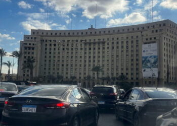 Vehicles wait in a traffic jam in front of Mogamma building, Egypt's biggest administrative building, with a poster for The Sovereign Fund of Egypt (TSFE), at Tahrir Square in downtown Cairo, Egypt January 24, 2024. REUTERS/Amr Abdallah Dalsh