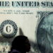 A woman walks past a currency exchange point, displaying an image of the U.S. dollar, in Cairo, Egypt, March 6, 2024. REUTERS/Mohamed Abd El Ghany