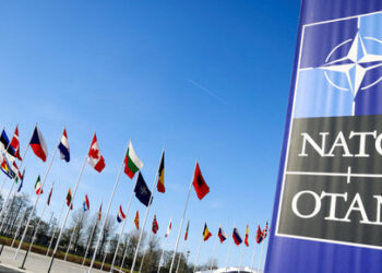 FILE PHOTO: Flags flutter as a NATO foreign ministers' meeting takes place at the Alliance's headquarters in Brussels, Belgium April 4, 2023. REUTERS/Johanna Geron/File Photo