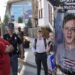 A man walks by a poster depicting Thomas Matthew Crooks, the man that attempted to assassinate former President Donald Trump during the third day of the 2024 Republican National Convention near the Fiserv Forum, Wednesday, July 17, 2024, in Milwaukee. (AP Photo/Alex Brandon)