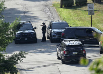 Law enforcement block a street in Bethel Park, Pa., that they say had a residence of Thomas Matthew Crooks, the suspected shooter of former President Donald Trump, Sunday, July 14, 2024. (AP Photo/Joshua A. Bickel)