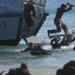 Philippine Military Academy (PMA) cadets move ashore from a navy ship during a joint field training exercise at the Marines' training centre in Ternate, Cavite city, south of Manila May 29, 2013. Future military officers in the Philippines undergo annual drills at a Marines base for training on coastal defense and amphibious operations as the nation shifts its security policy from fighting rebels to defending territories in disputed waters in South China Sea, according to the military. REUTERS/Romeo Ranoco (PHILIPPINES - Tags: POLITICS MILITARY)